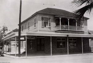 Stiglich Grocery, 2728 Avenue Q. Two People Barely Seen On Upper Porch, 1936, From The Corner Stores Of Galveston, Galveston County Cultural Arts Council — Betty Tichich
