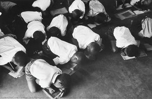 Students Kneel On Floor To Write. Government Is Casual About Furnishing Schools For Blacks - Photographs From House Of Bondage, 1958-66 — Ernest Levi Tsoloane Cole
