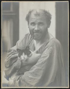 Gustav Klimt with a cat in the garden of his studio at Josefstädter Straße 21