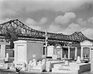 St. Bartholomew Cemetery With Crescent City Connection In Background; Algiers Point, New Orleans — Richard Sexton