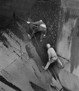 Men cleaning cargo hold on steamer ‘Crispin Oglebay’