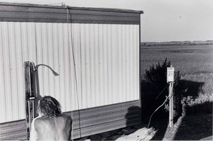 Untitled (man At Outside Shower) — Burk Uzzle
