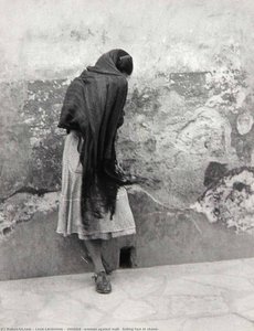 Untitled (woman Against Wall, Hiding Face In Shawl) — Leon Levinstein