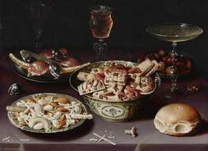 A Still Life Of Porcelain Vessels Containing Sweets, Pewter Plates Bearing Sweets And Chestnuts, Three Pieces Of Glassware And A Bread Roll On A Table Draped With A Mauve Cloth — Osias Beert The Elder