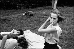 Woman smoking with friends.