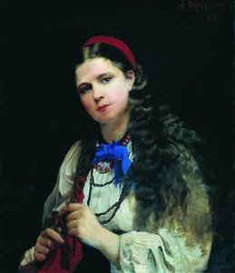 A girl braiding her hair