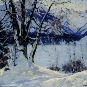 A frozen lake in a mountainous winter landscape