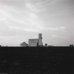 Grain Elevator And Plowed Field, Wellington, Kansas, 1973 — Frank Gohlke