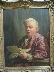 Portrait d'homme assis à sa table de travail